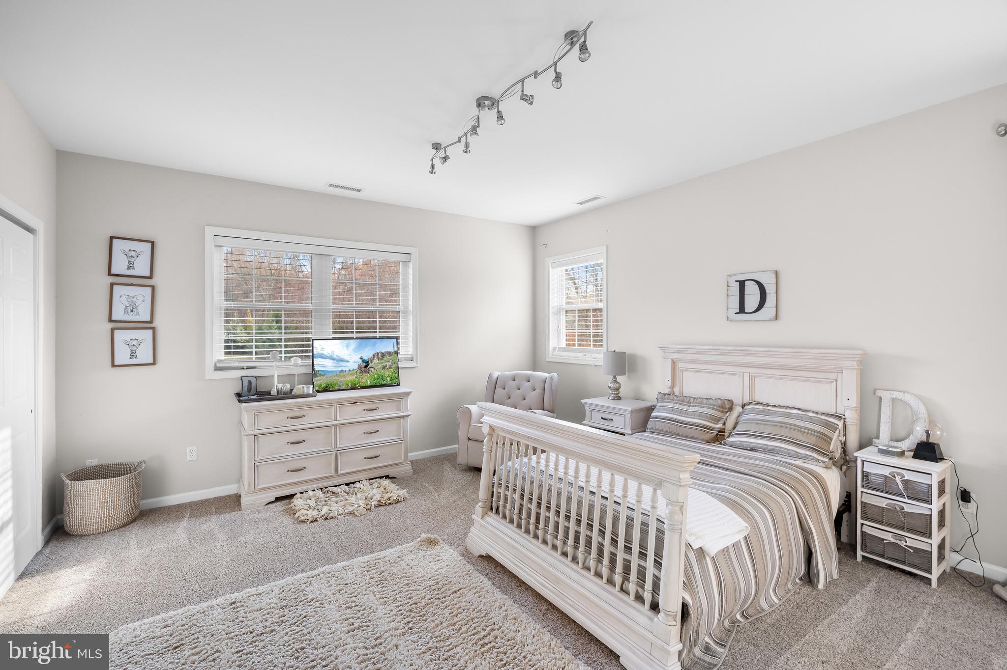 205 Sherwin Road Mullica Hill, NJ 08062 - Photo 38 of 70 a spacious bedroom with a bed and a window