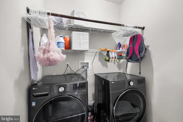 a view of a roof deck with table and chairs a barbeque with wooden floor and fence