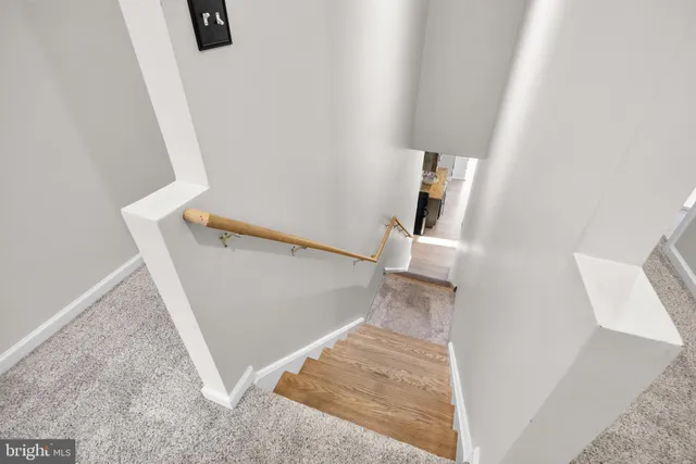 a view of a dinning table and chair in the back yard of the house