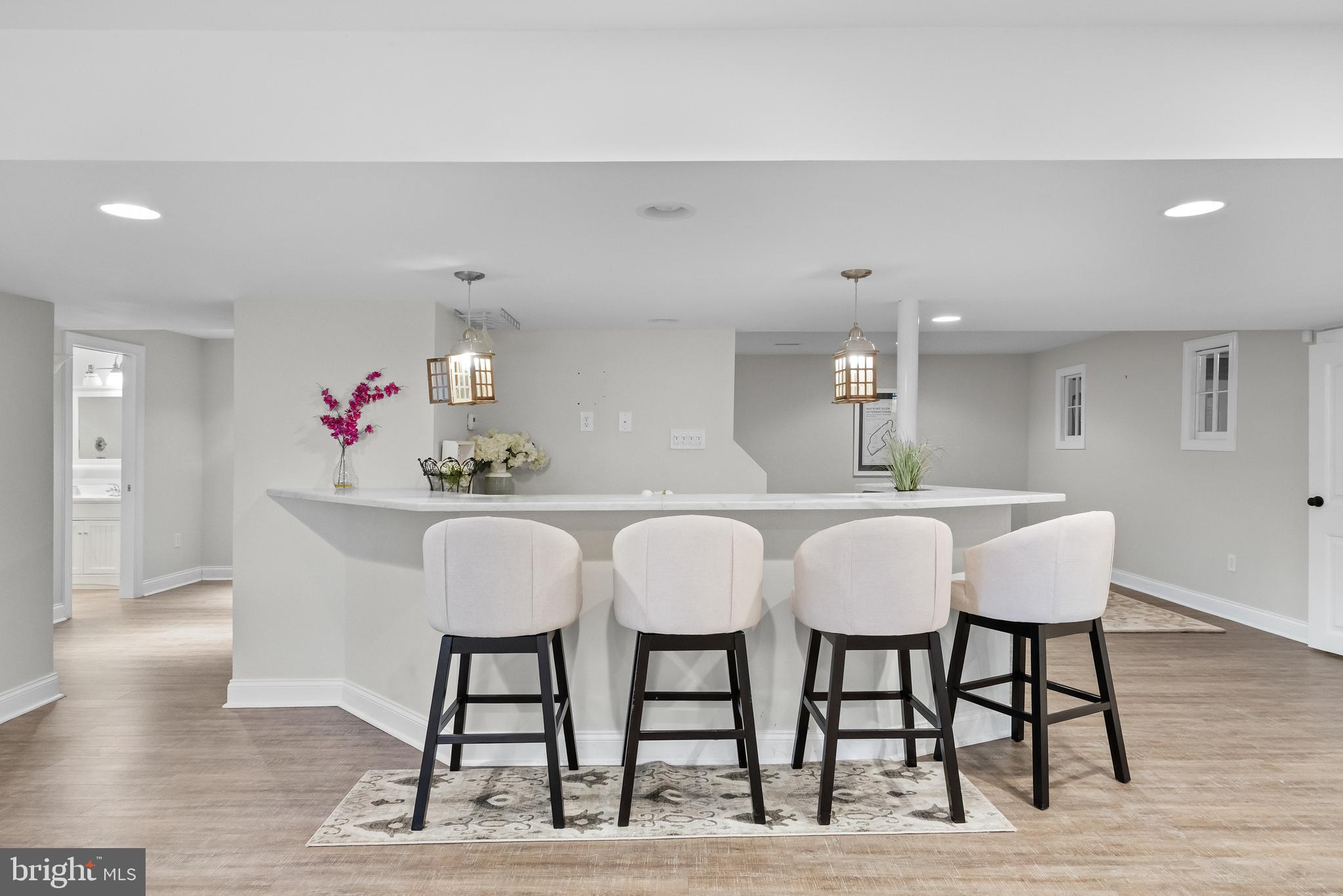 205 Sherwin Road Mullica Hill, NJ 08062 - Photo 46 of 70 a dining room with furniture and wooden floor