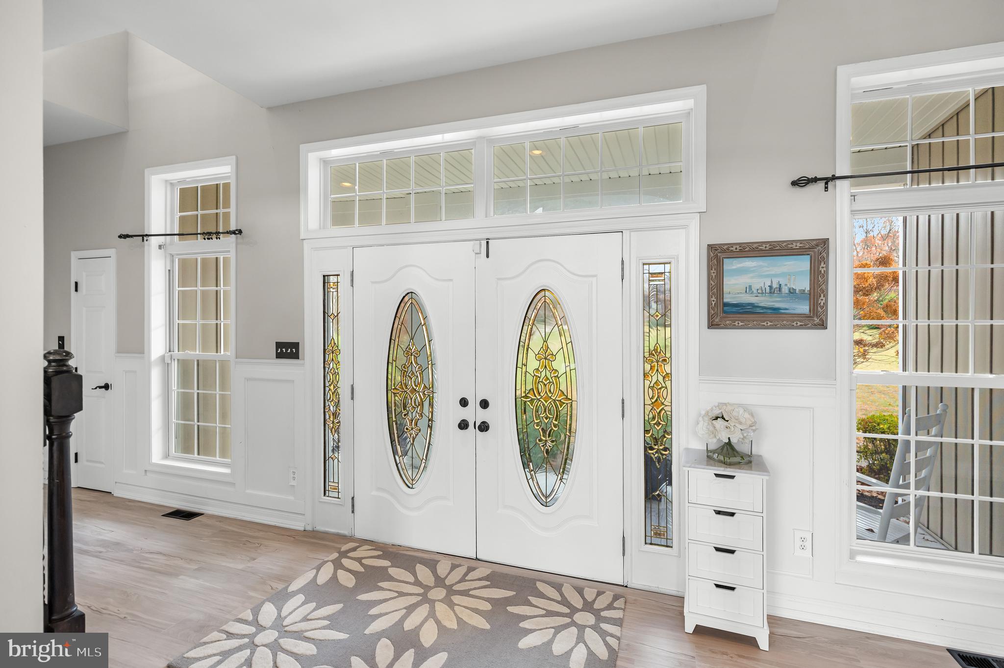 205 Sherwin Road Mullica Hill, NJ 08062 - Photo 5 of 70 a view of an entryway with wooden floor and windows