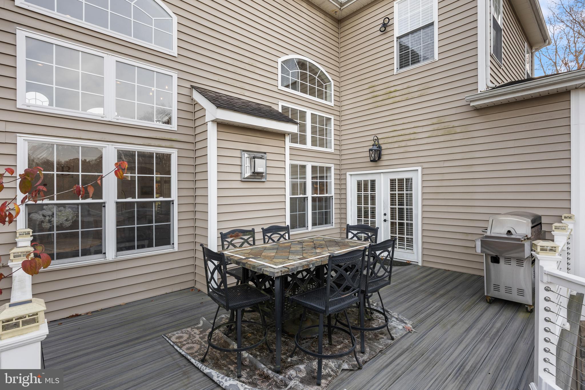 205 Sherwin Road Mullica Hill, NJ 08062 - Photo 57 of 70 a view of a dinning table and chair in the back yard of the house