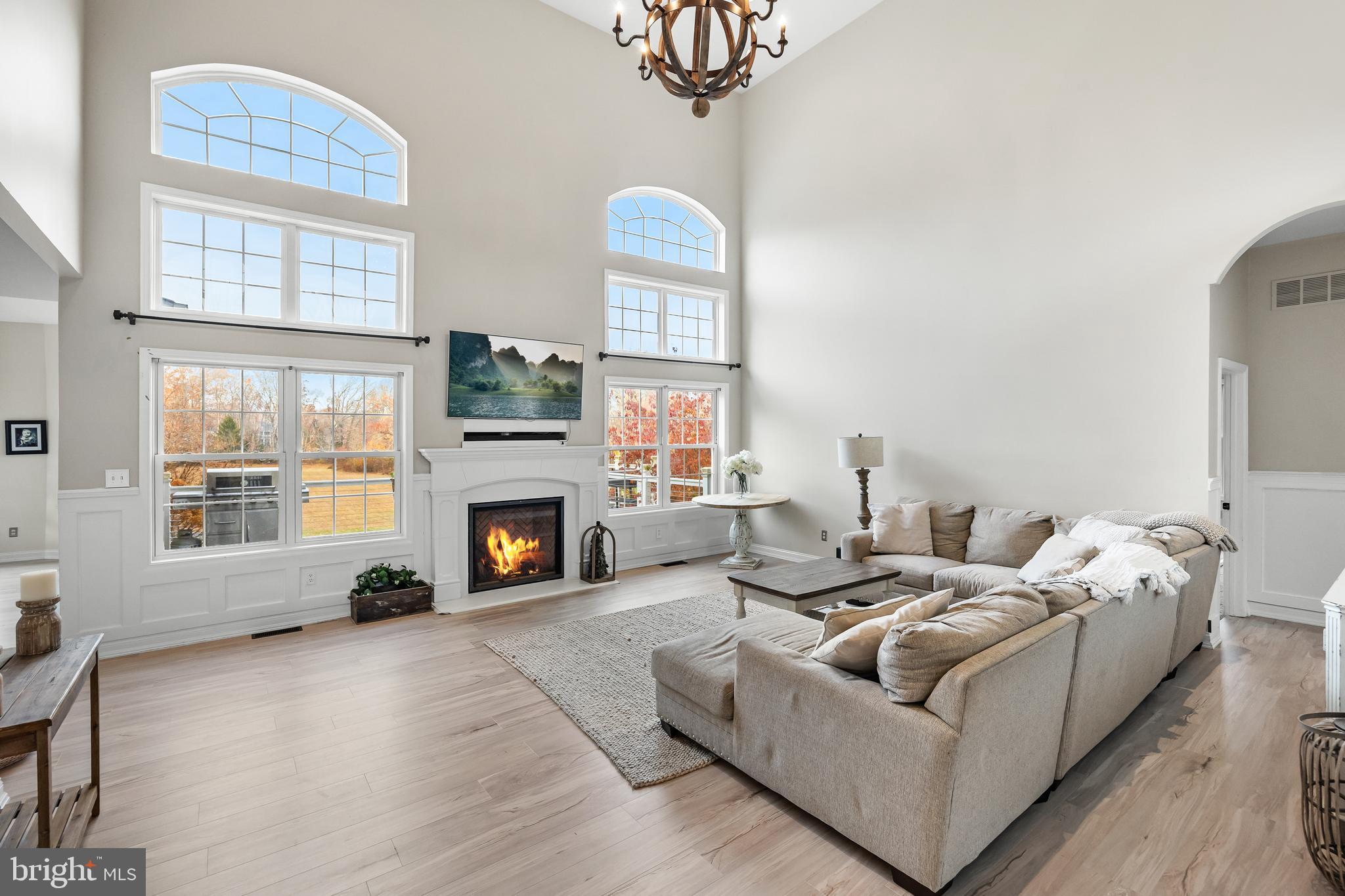 205 Sherwin Road Mullica Hill, NJ 08062 - Photo 6 of 70 a living room with furniture a fireplace and a large window