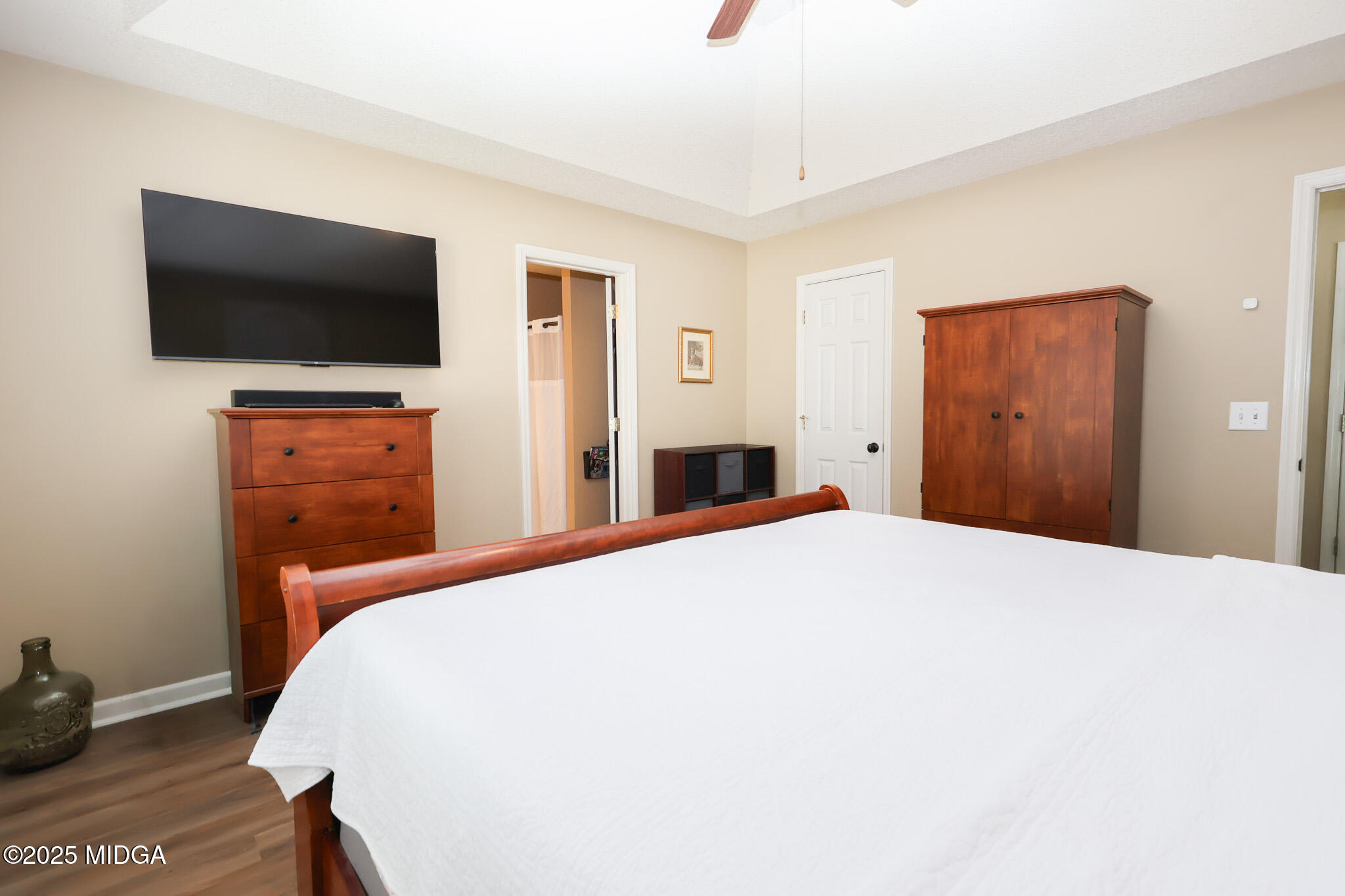 215 Stonefield Circle Macon, GA 31216 - Photo 12 of 26 a bedroom with a bed and a flat screen tv