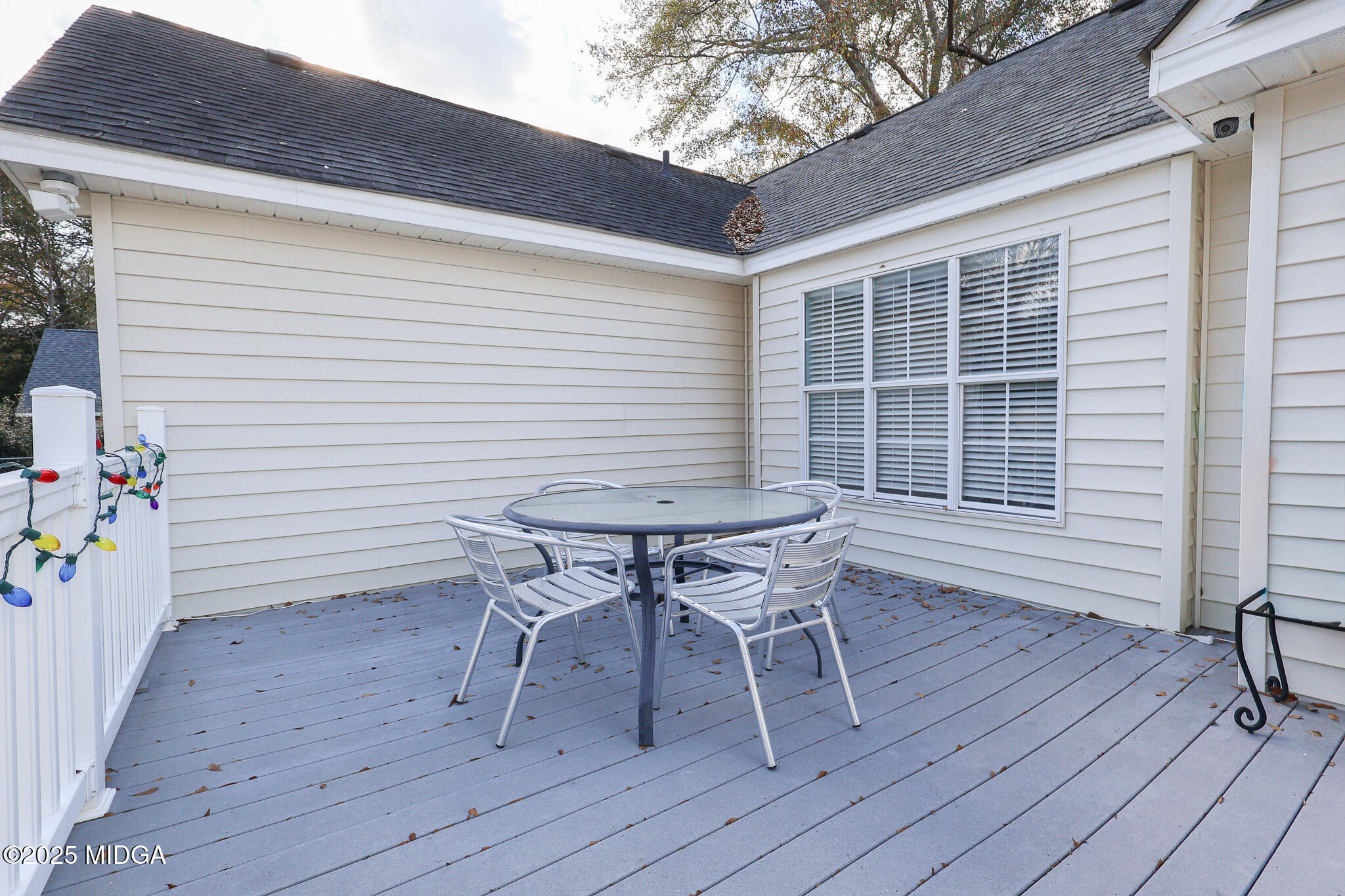 215 Stonefield Circle Macon, GA 31216 - Photo 19 of 26 a roof deck with a table and chairs and wooden floor