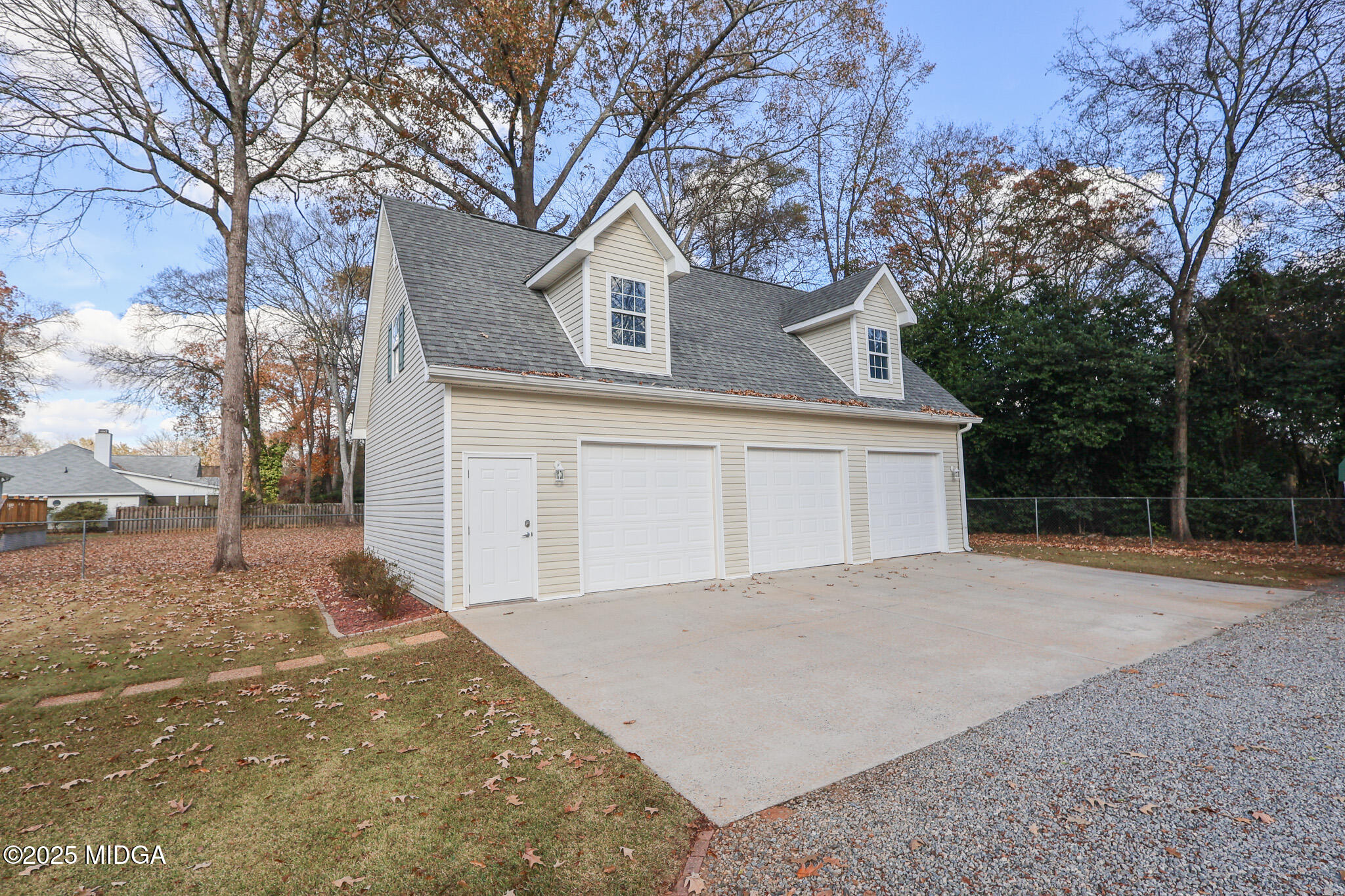 215 Stonefield Circle Macon, GA 31216 - Photo 20 of 26 a front view of a house with a yard and garage