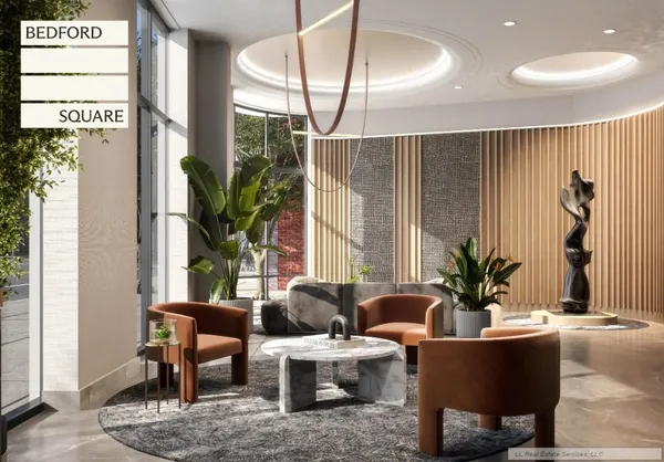 a living room with furniture a potted plant and a large window