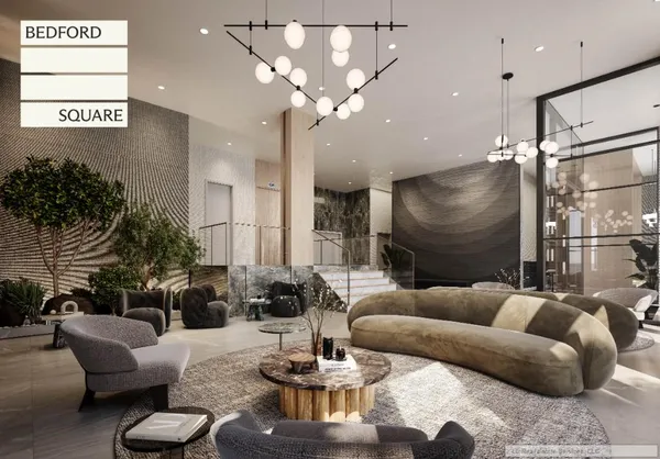 a living room with furniture and a chandelier