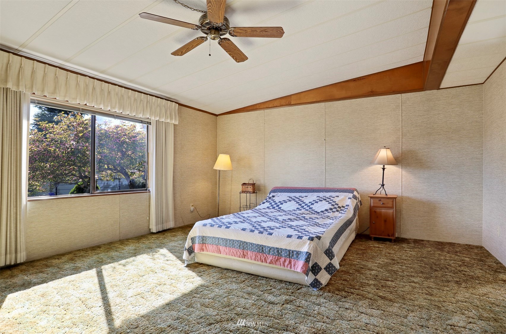 23627 Lake Drive East Bothell, WA 98021 - Photo 11 of 40 a bedroom with a bed and a window