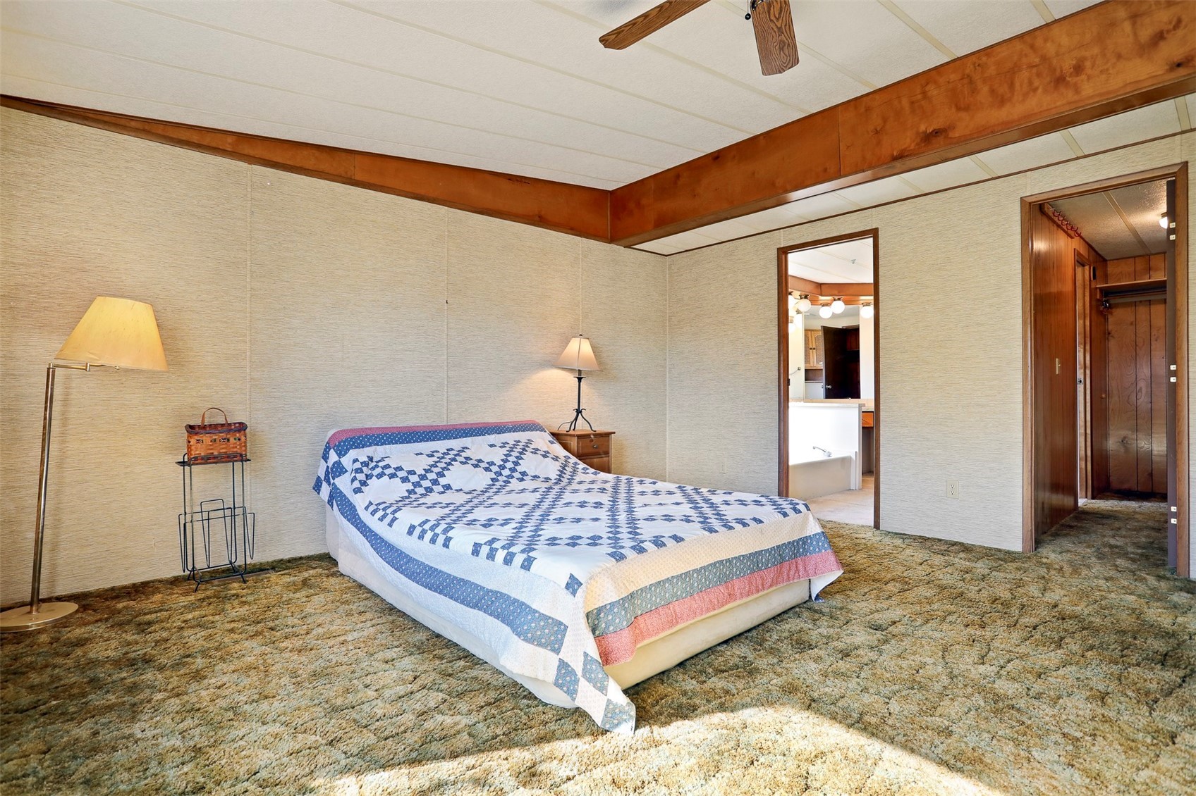 23627 Lake Drive East Bothell, WA 98021 - Photo 12 of 40 a bedroom with a bed and a dresser