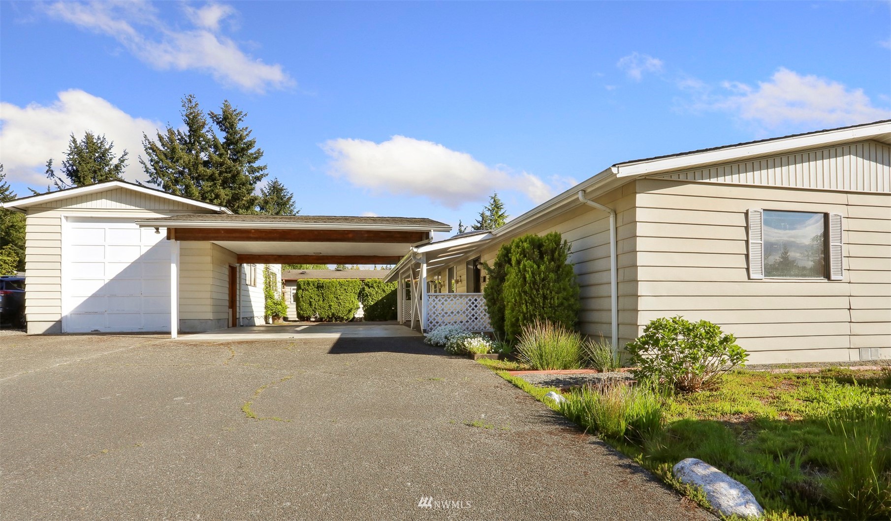 23627 Lake Drive East Bothell, WA 98021 - Photo 26 of 40 a view of a house with porch and garden