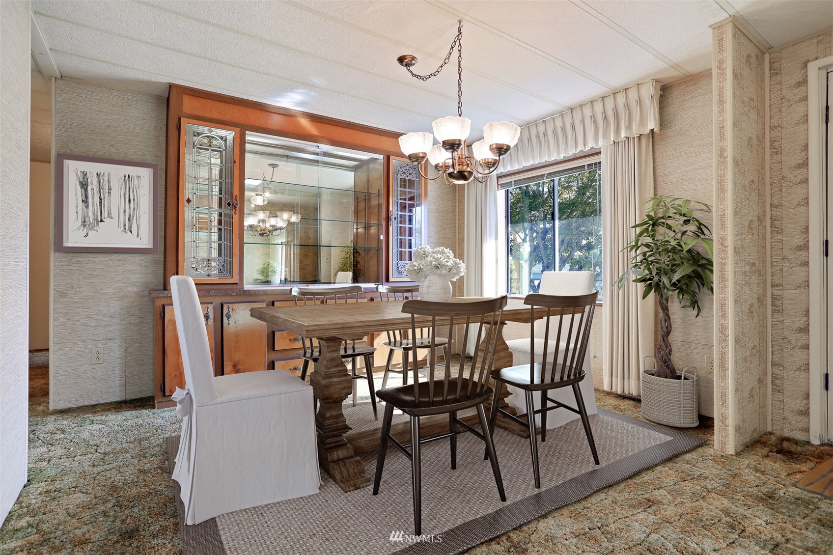 23627 Lake Drive East Bothell, WA 98021 - Photo 5 of 40 a view of a dining room with furniture window and wooden floor