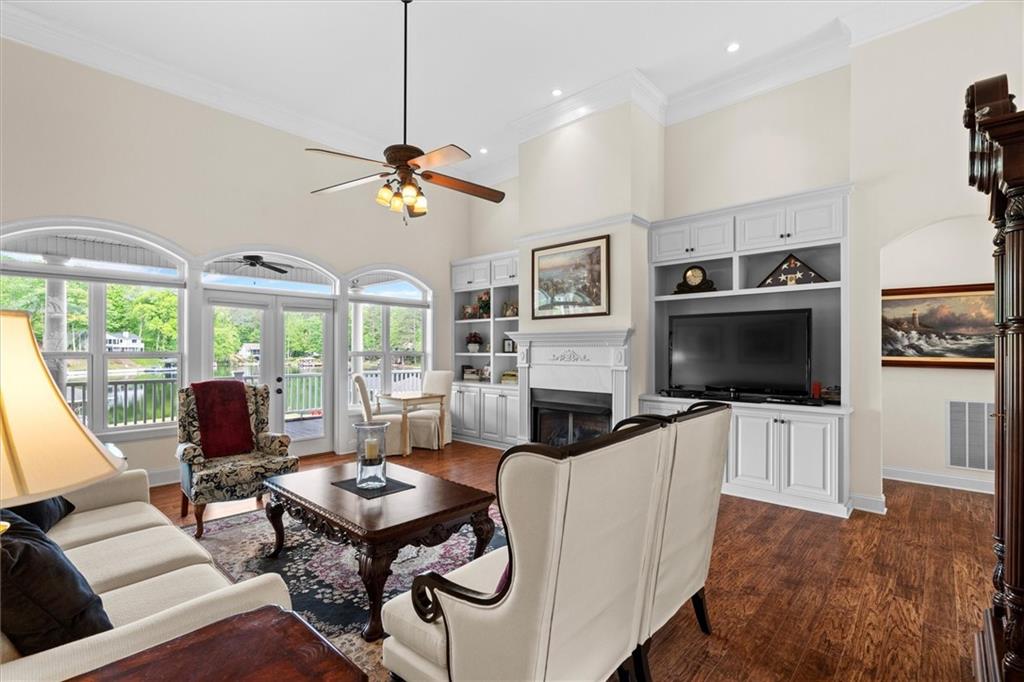 2191 Lakeview Parkway Villa Rica, GA 30180 - Photo 11 of 96 a living room with furniture a flat screen tv and a large window