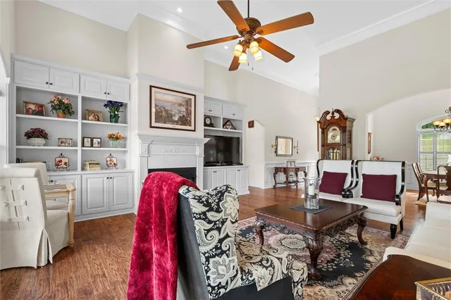 a kitchen with stainless steel appliances granite countertop a stove a sink a dining table and chairs