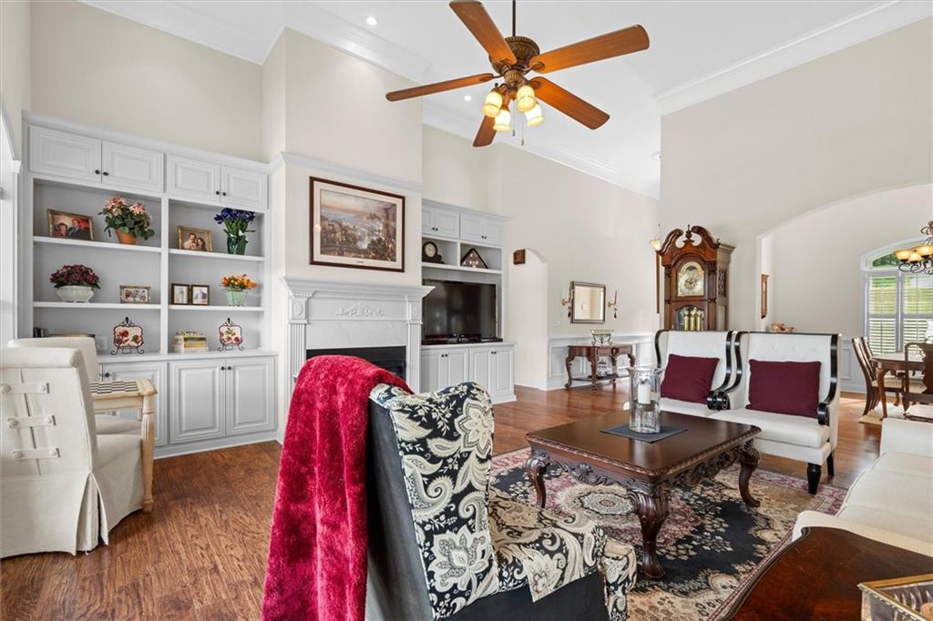 2191 Lakeview Parkway Villa Rica, GA 30180 - Photo 13 of 96 a living room with furniture a flat screen tv and a table