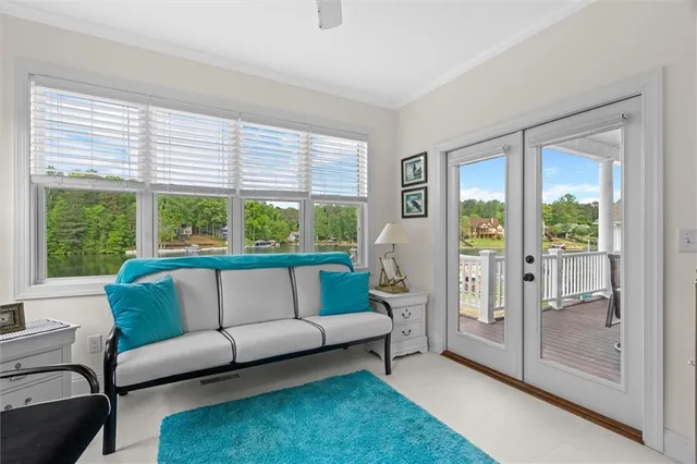 a bathroom with a granite countertop double vanity and a mirror