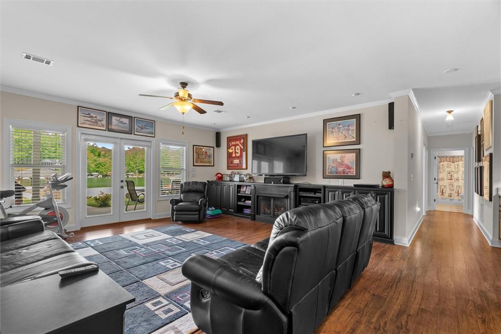 2191 Lakeview Parkway Villa Rica, GA 30180 - Photo 34 of 96 a living room with furniture flat screen tv and a large window
