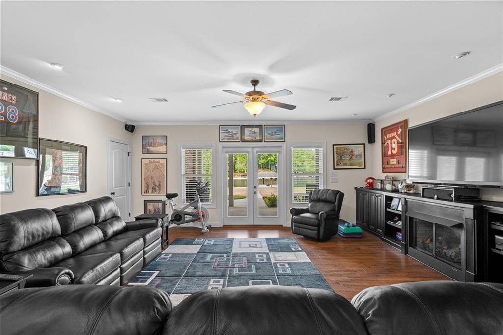 2191 Lakeview Parkway Villa Rica, GA 30180 - Photo 35 of 96 a living room with furniture and a flat screen tv