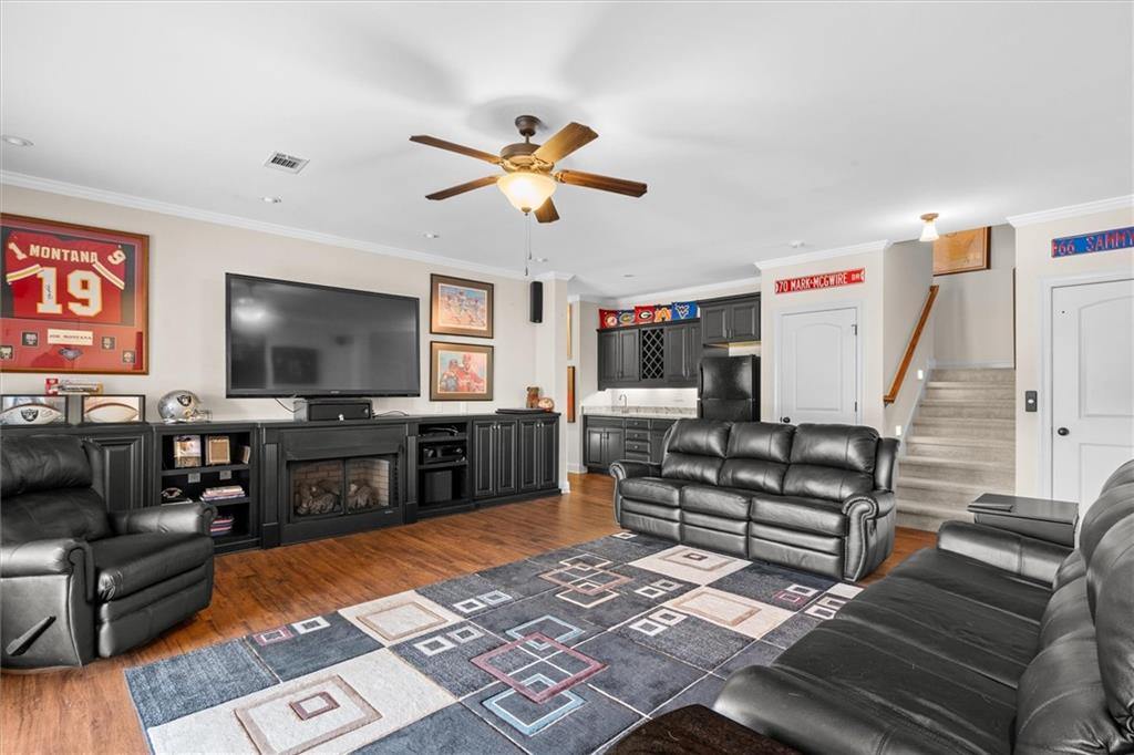 2191 Lakeview Parkway Villa Rica, GA 30180 - Photo 37 of 96 a living room with furniture and a flat screen tv