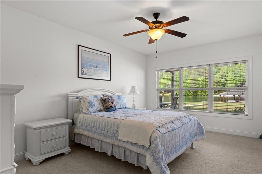 2191 Lakeview Parkway Villa Rica, GA 30180 - Photo 40 of 96 a bedroom with a bed and a large window