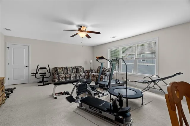 a view of a lake with houses in the background