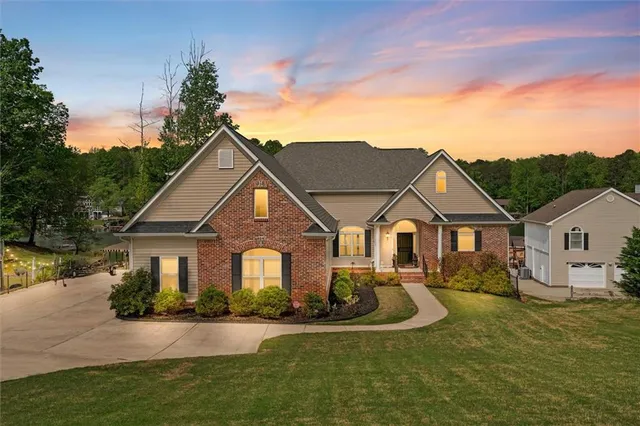 a front view of a house with a yard table and chairs