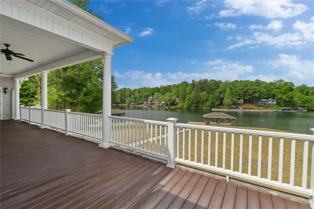 2191 Lakeview Parkway Villa Rica, GA 30180 - Photo 64 of 96 a view of a wooden deck next to a lake