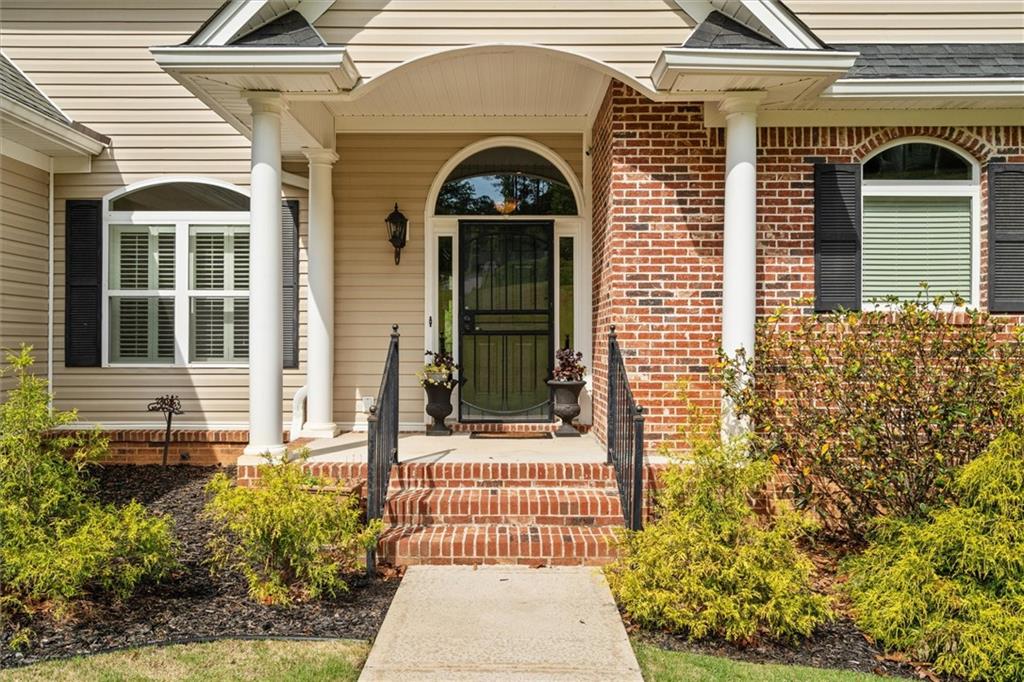2191 Lakeview Parkway Villa Rica, GA 30180 - Photo 7 of 96 a front view of a house with a garden