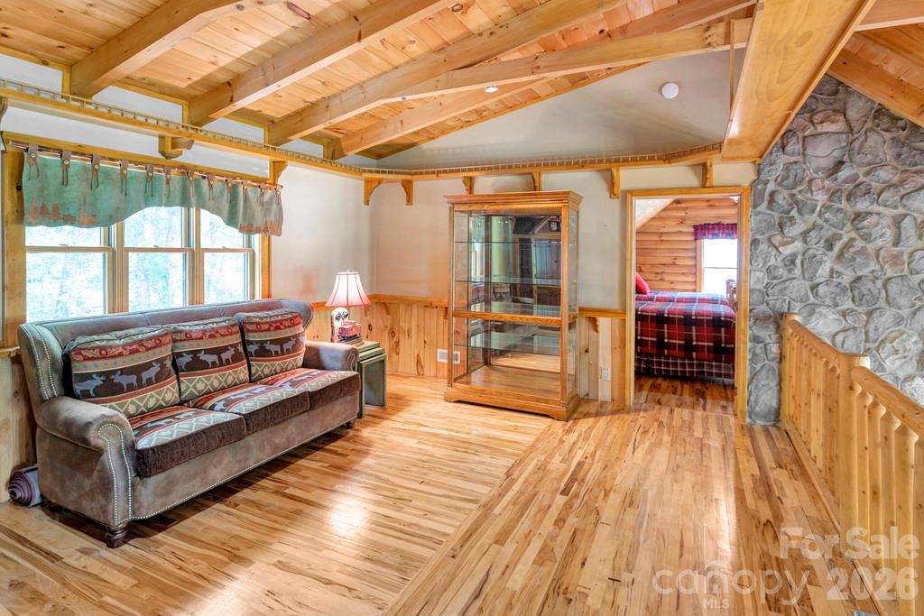 35 Falcon Crest Loop Maggie Valley, NC 28751 - Photo 23 of 46 a living room with furniture and a wooden floor