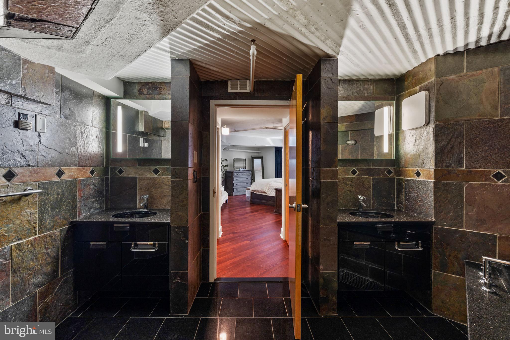 2200-28 Arch Street, Unit 1205 Philadelphia, PA 19103 - Photo 23 of 48 a bathroom with a glass shower door