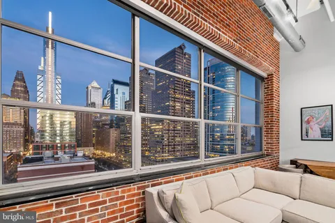a balcony with table and chairs
