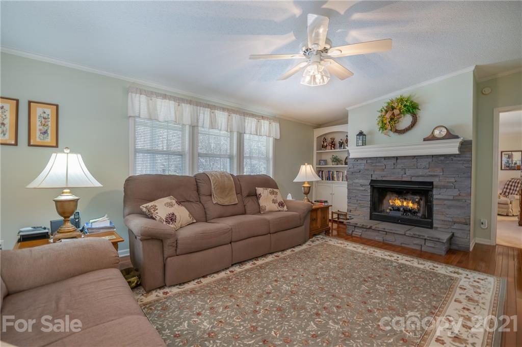 569 Flynn Road Rutherfordton, NC 28139 - Photo 15 of 34 a living room with furniture and a fireplace
