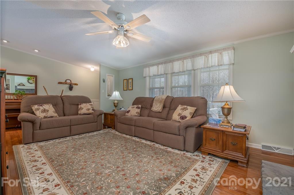 569 Flynn Road Rutherfordton, NC 28139 - Photo 16 of 34 a living room with furniture and a chandelier