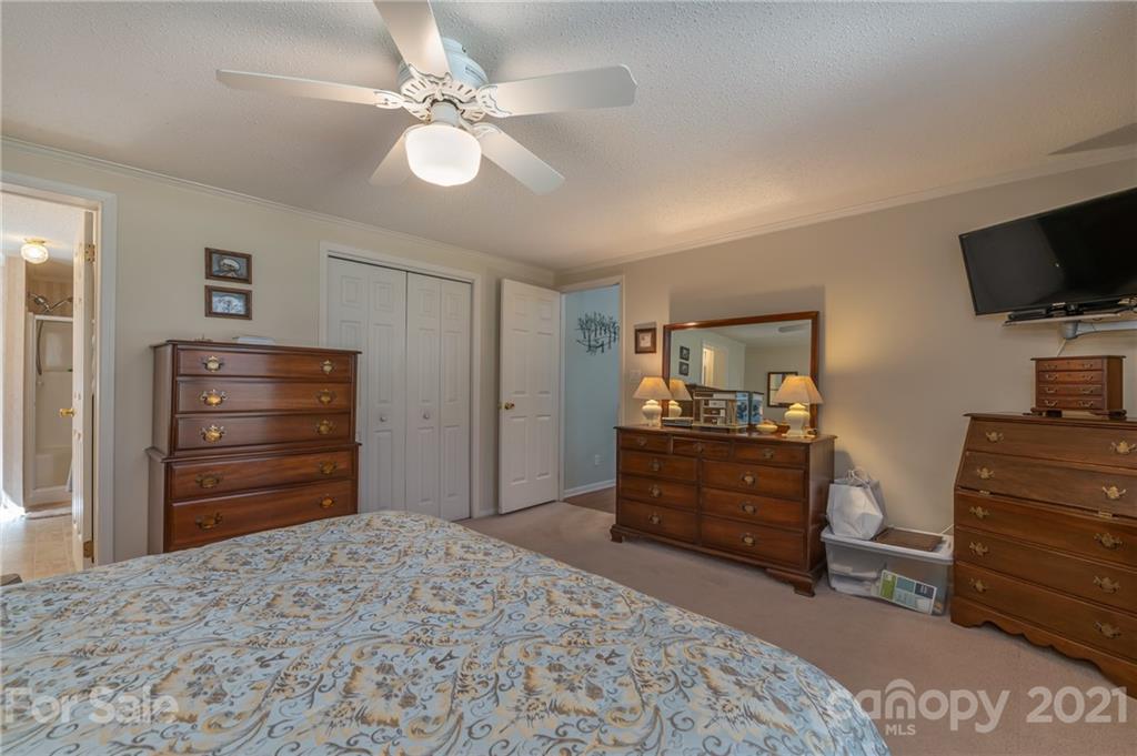 569 Flynn Road Rutherfordton, NC 28139 - Photo 18 of 34 a bedroom with a bed and furniture