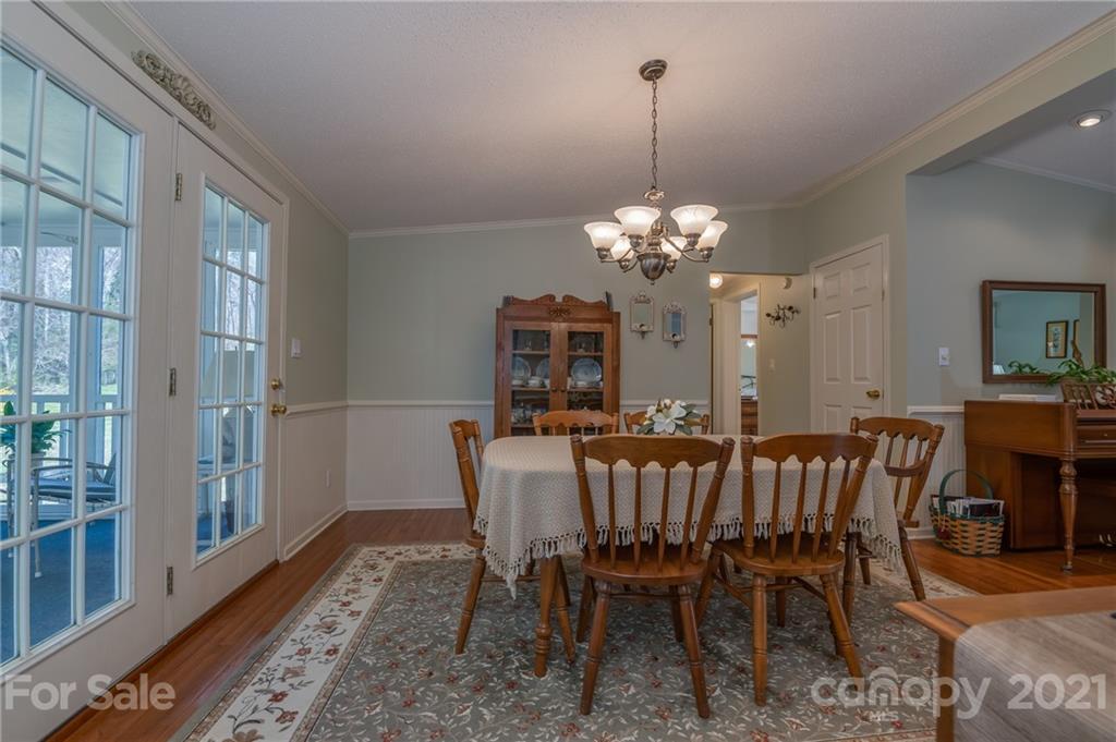 569 Flynn Road Rutherfordton, NC 28139 - Photo 24 of 34 a view of a dining room with furniture and chandelier