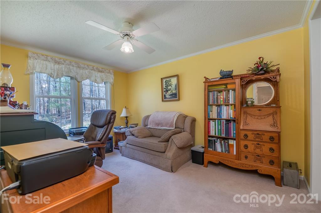 569 Flynn Road Rutherfordton, NC 28139 - Photo 26 of 34 a living room with furniture and a window