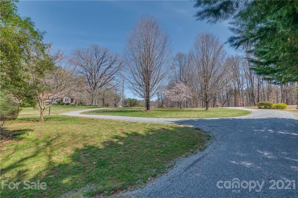 569 Flynn Road Rutherfordton, NC 28139 - Photo 5 of 34 a view of a swimming pool with a yard