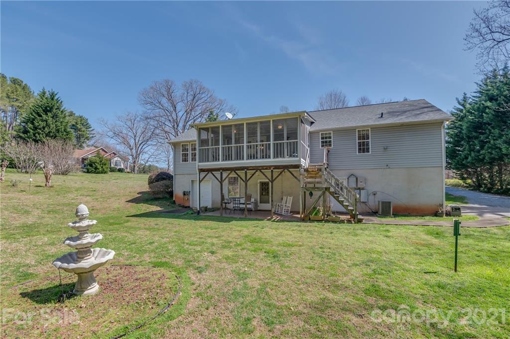 569 Flynn Road Rutherfordton, NC 28139 - Photo 8 of 34 a view of a house with backyard and sitting area