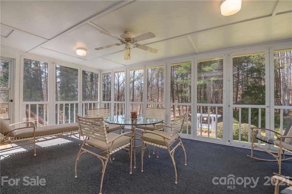 569 Flynn Road Rutherfordton, NC 28139 - Photo 10 of 34 a living room with furniture and large windows