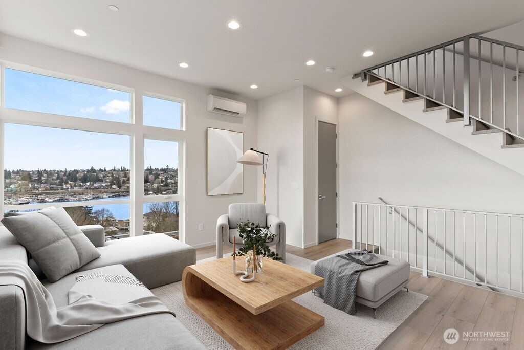 a living room with furniture and a large window