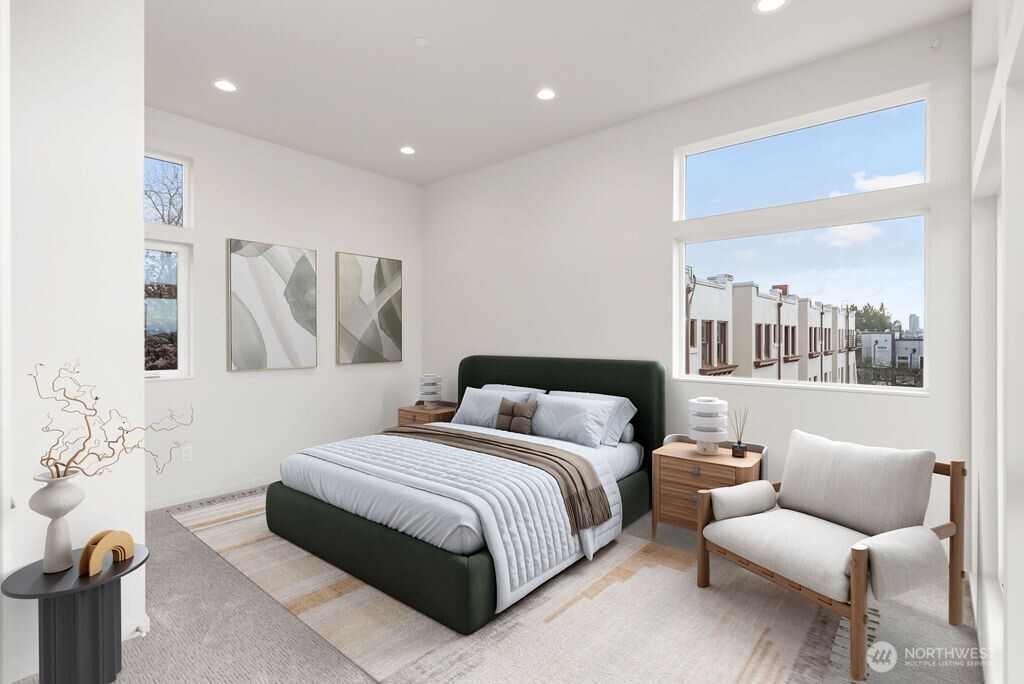 2921 Franklin Avenue East, Unit B Seattle, WA 98102 - Photo 16 of 30 a bedroom with a bed and a couch