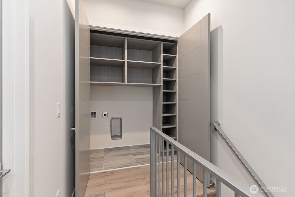 2921 Franklin Avenue East, Unit B Seattle, WA 98102 - Photo 20 of 30 a view of a hallway with wooden cabinets and a window