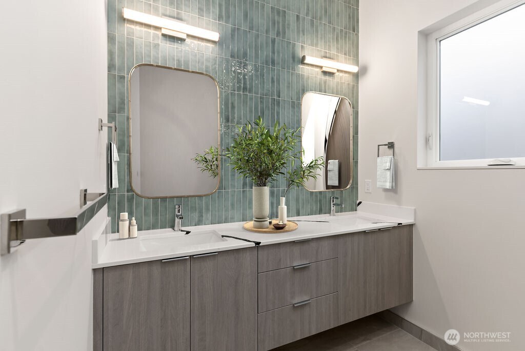 2921 Franklin Avenue East, Unit B Seattle, WA 98102 - Photo 22 of 30 a bathroom with double vanity sinks and a mirror
