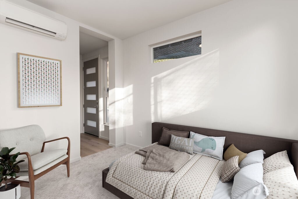 2921 Franklin Avenue East, Unit B Seattle, WA 98102 - Photo 26 of 30 a bedroom with a bed and a couch