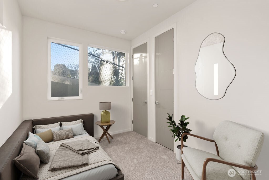 2921 Franklin Avenue East, Unit B Seattle, WA 98102 - Photo 27 of 30 a living room with furniture and a mirror