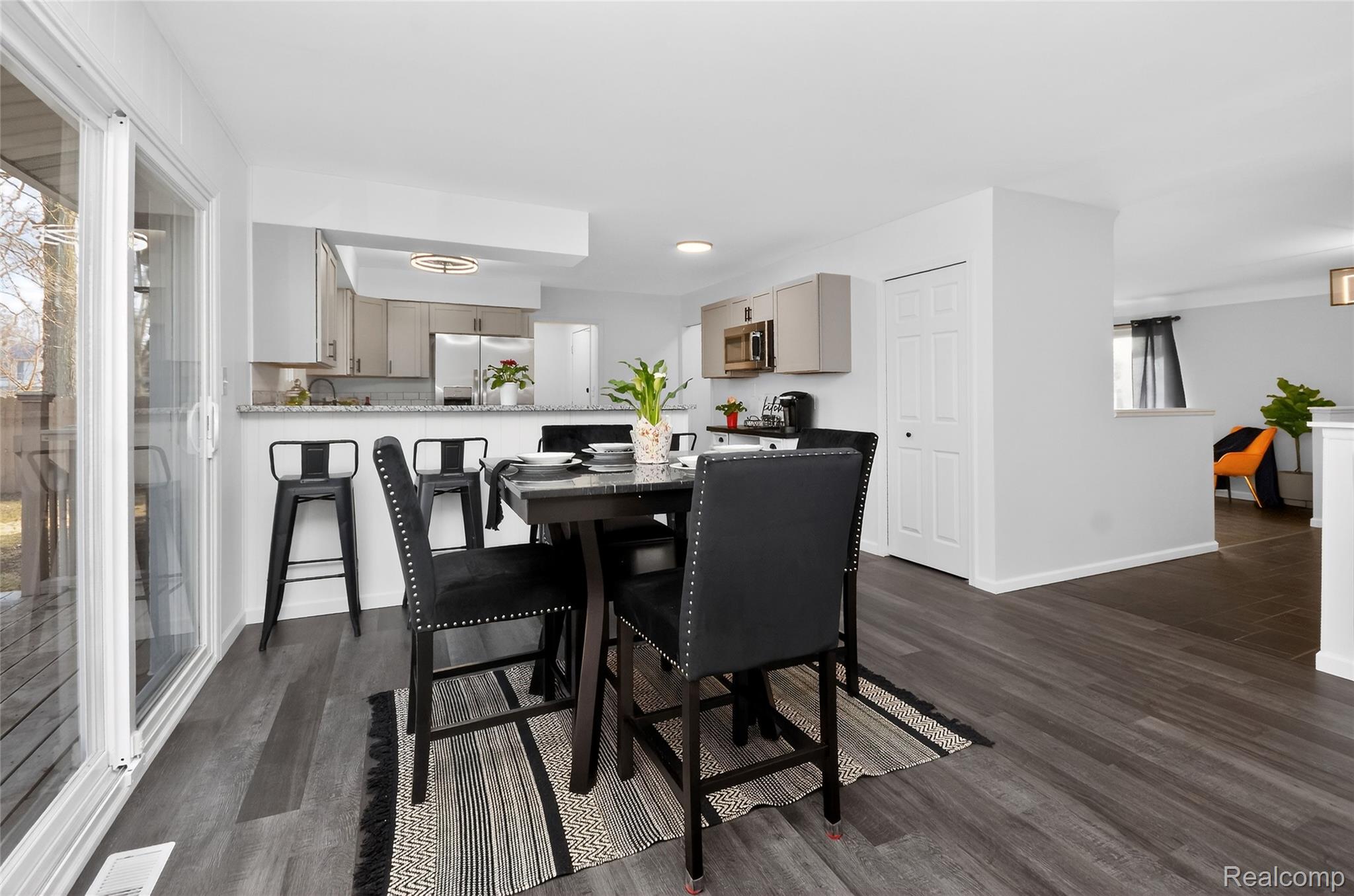 24065 Rockingham Street Southfield, MI 48033 - Photo 8 of 35 Dining area with dark wood-type flooring and baseboards