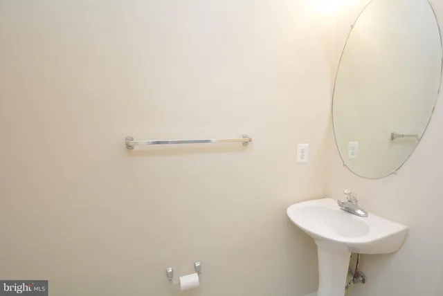 a bathroom with a sink a mirror and vanity