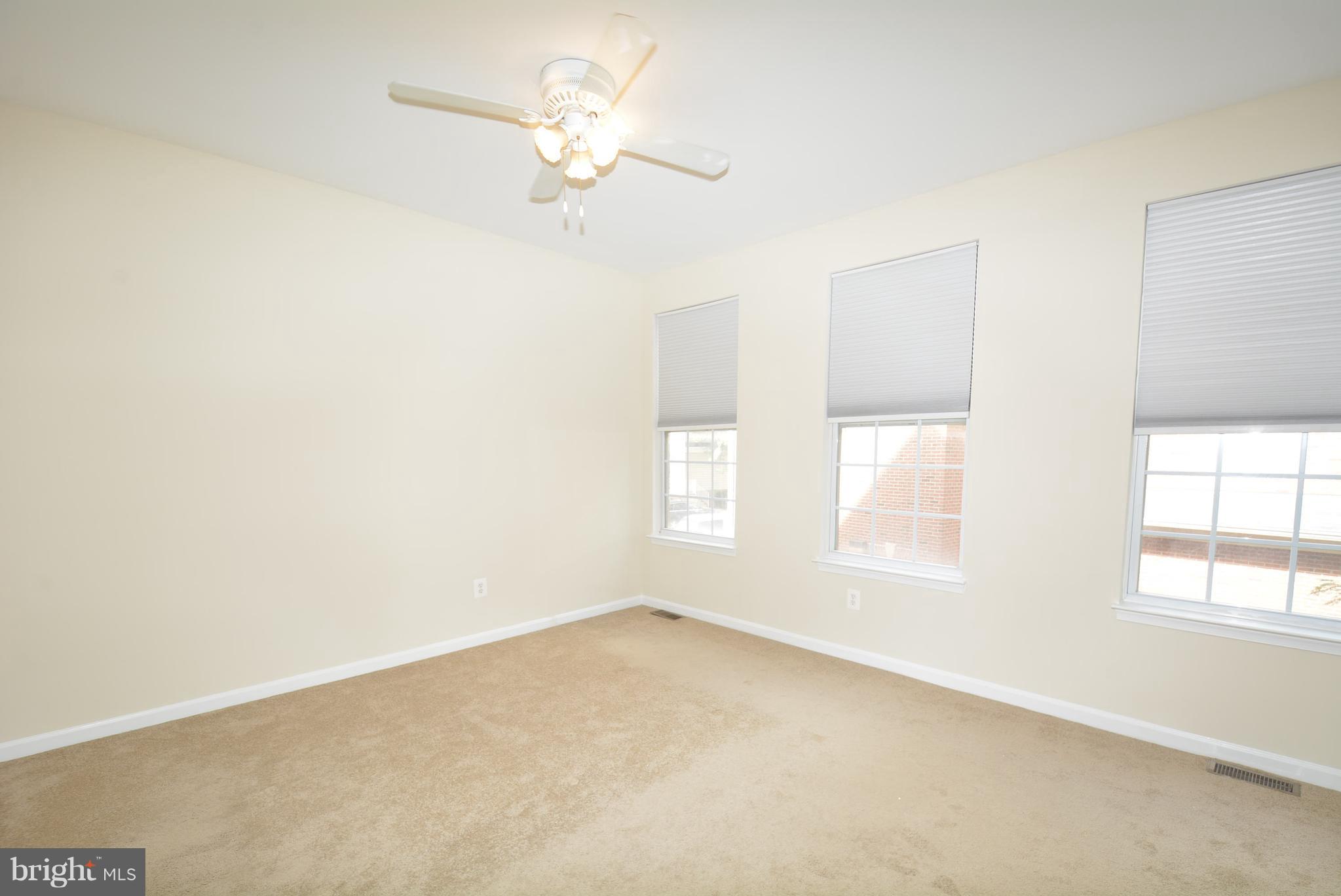 2665 Manhattan Place, Unit 101 Vienna, VA 22180 - Photo 13 of 23 an empty room with a window