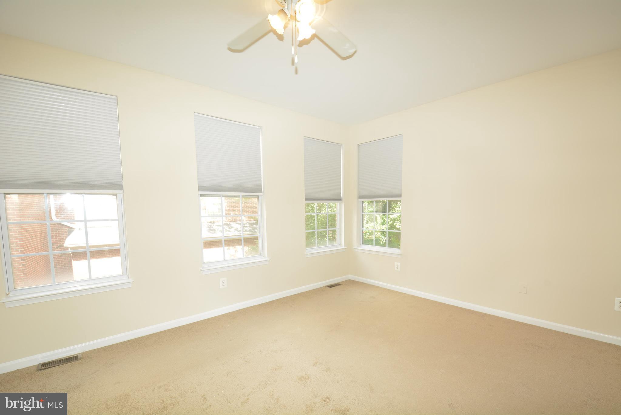 2665 Manhattan Place, Unit 101 Vienna, VA 22180 - Photo 14 of 23 a view of an empty room with a window