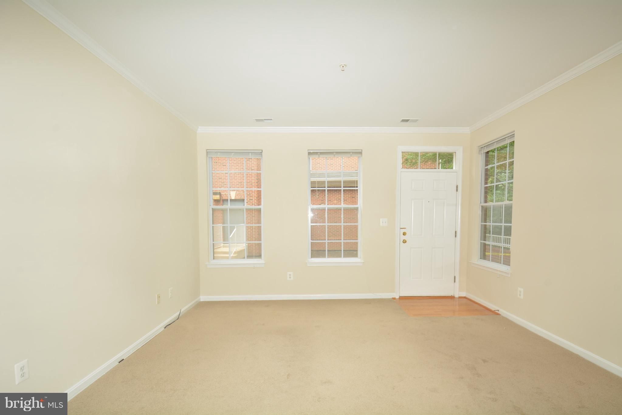 2665 Manhattan Place, Unit 101 Vienna, VA 22180 - Photo 3 of 23 an empty room with windows